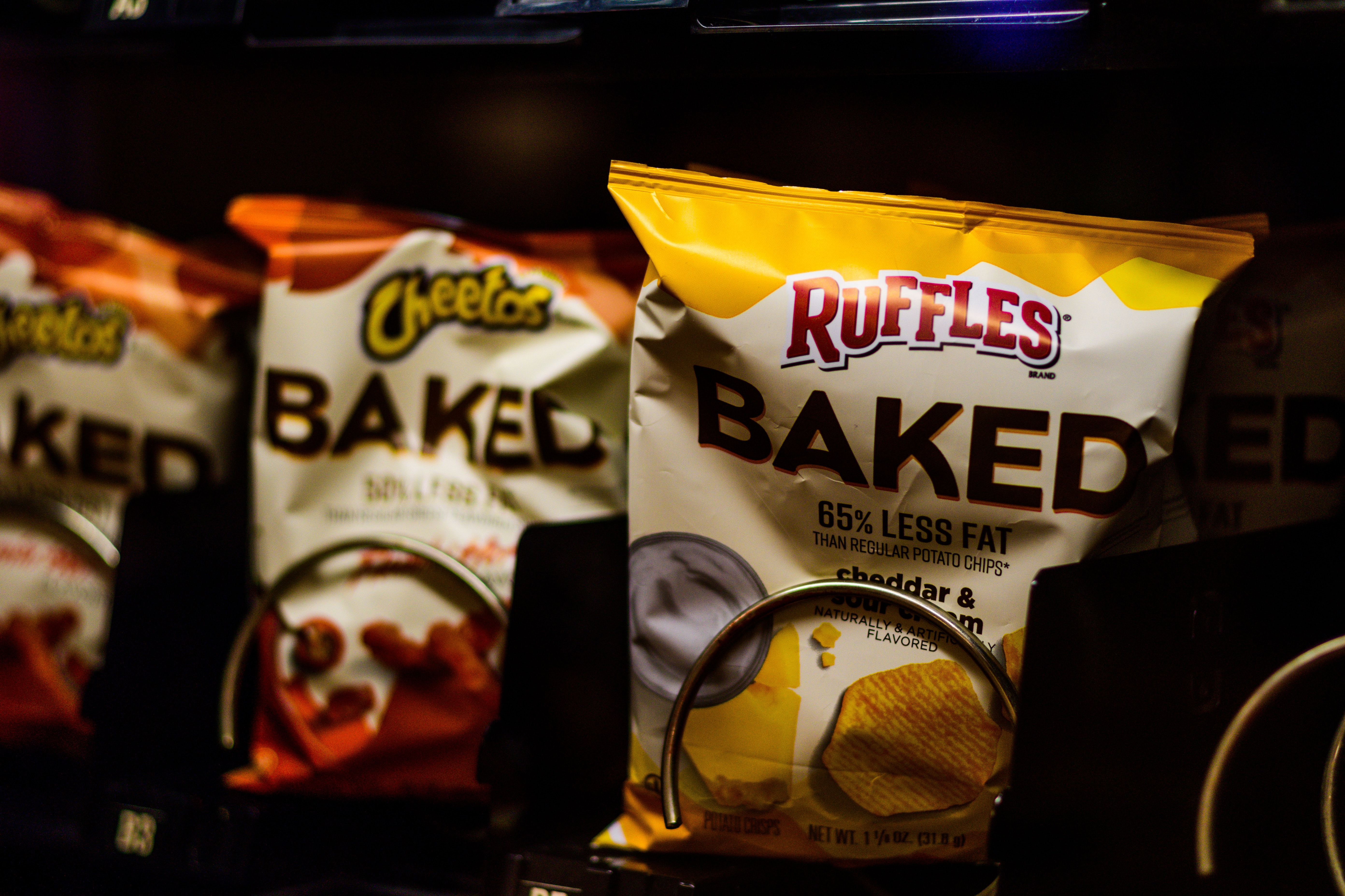 A close up of chips in a vending machine